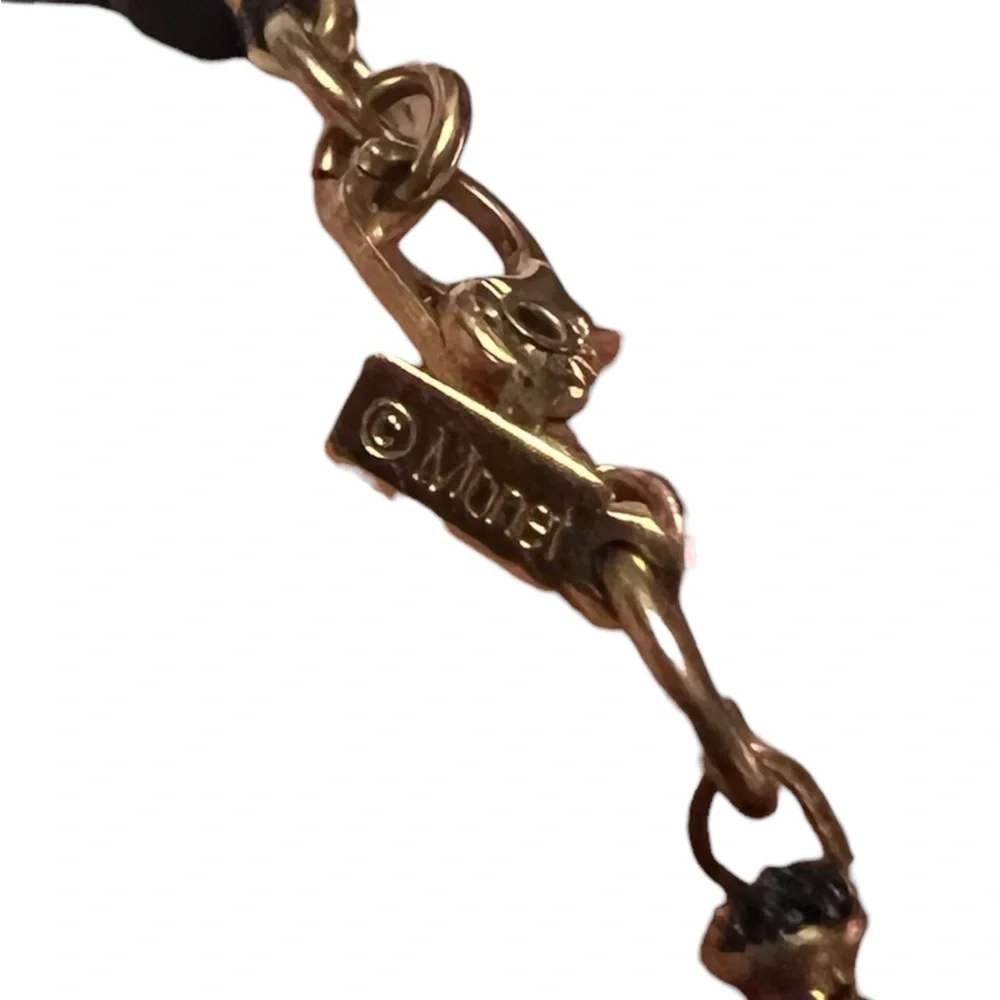 Vintage Monet signed black bead and gold tone spacers bracelet. 8”